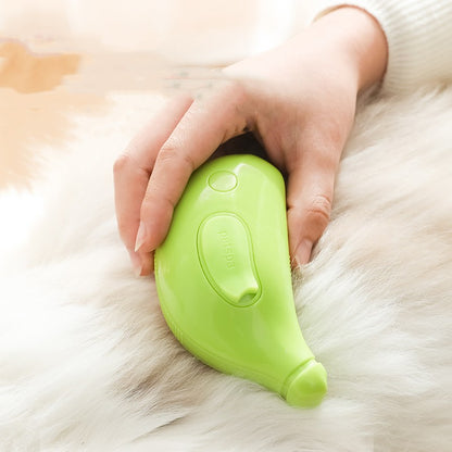 Green pet grooming tool being used on a fluffy white animal