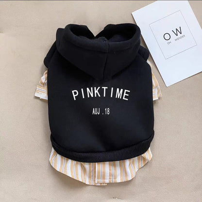 Black hoodie with 'PINKTIME' text on a beige surface