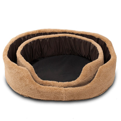 Brown pet bed with black interior on a white background