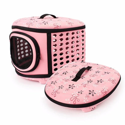 Pink pet carrier with floral patterns on a white background
