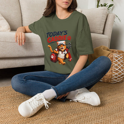 An olive green short-sleeve crewneck t-shirt featuring a cartoon graphic of an orange tabby cat wearing a cap and holding golf clubs, with the text 'TODAY'S CADDIE' 