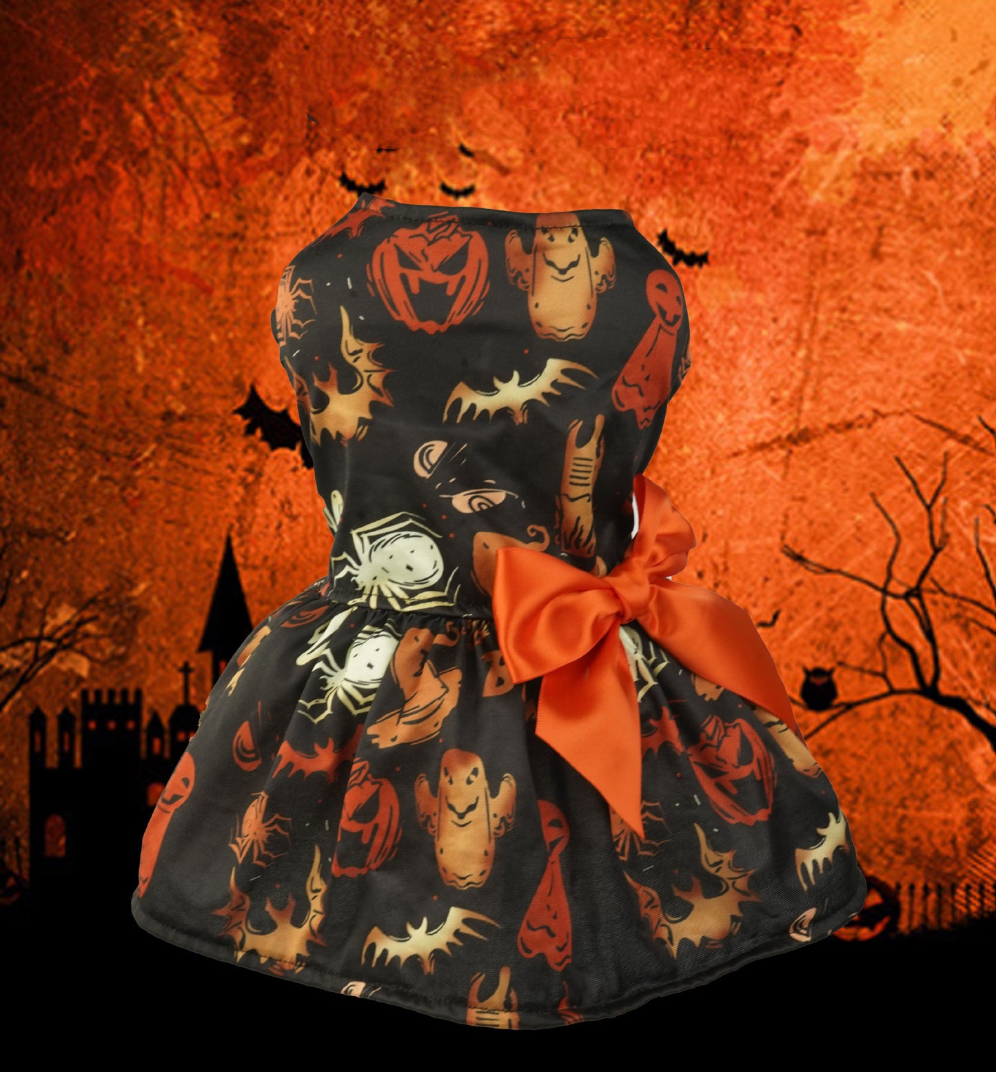 Halloween-themed dress with pumpkins, ghosts, and bats on a dark background.