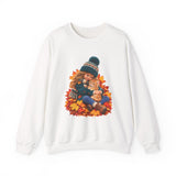 White crewneck sweatshirt featuring a little girl cuddling an orange tabby kitten among autumn leaves