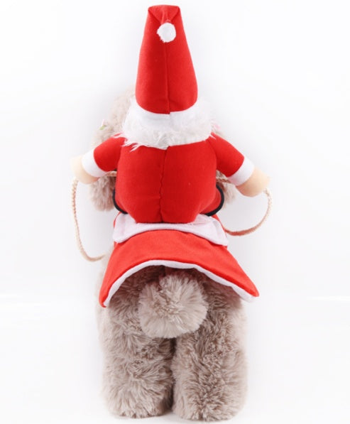Dog wearing a Santa costume with a red hat and coat on a white background