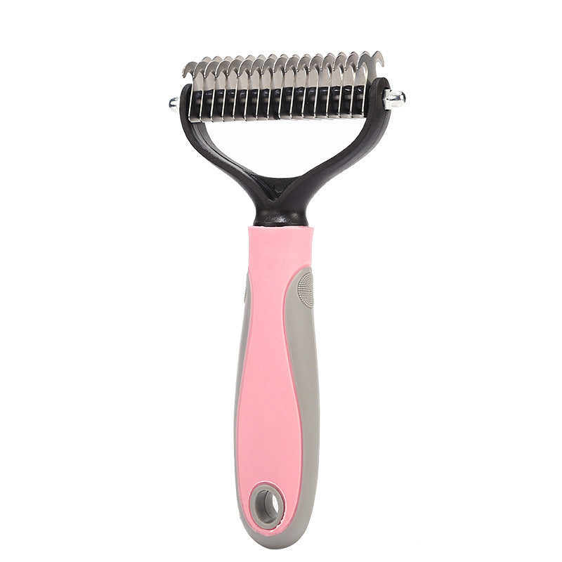 Pet grooming tool with pink handle and metal teeth on a white background