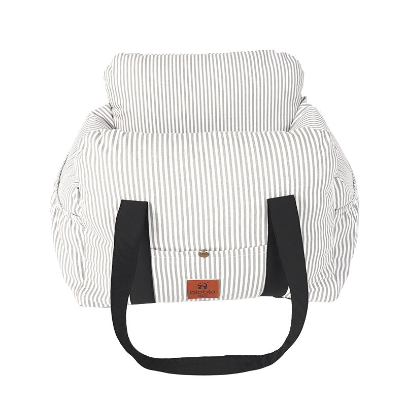 Striped bag with black handles on a white background