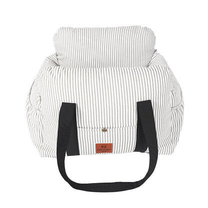 Striped bag with black handles on a white background