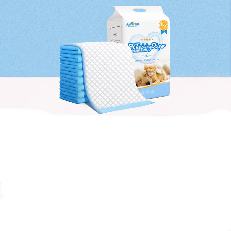 Stack of blue and white pet bed pads with packaging on a light blue background
