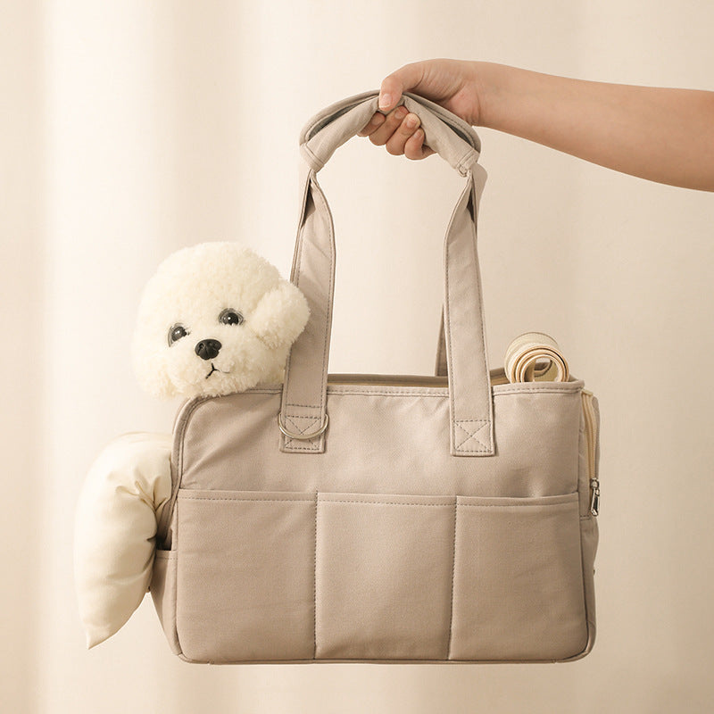 Beige tote bag with a white puppy and rolled-up mat on a light background