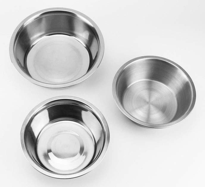 Three stainless steel bowls of different sizes on a white background