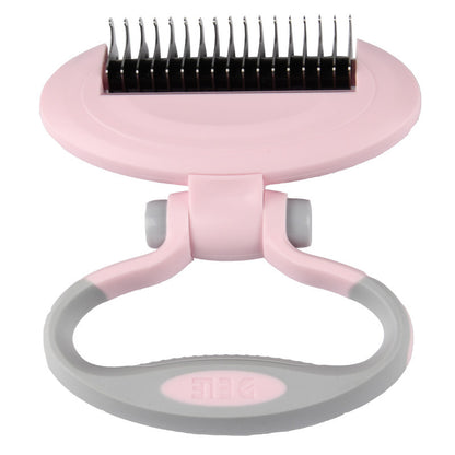 Pink and gray pet grooming brush on a white background