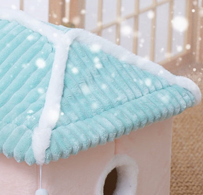 Cat tree with a turquoise roof and white trim
