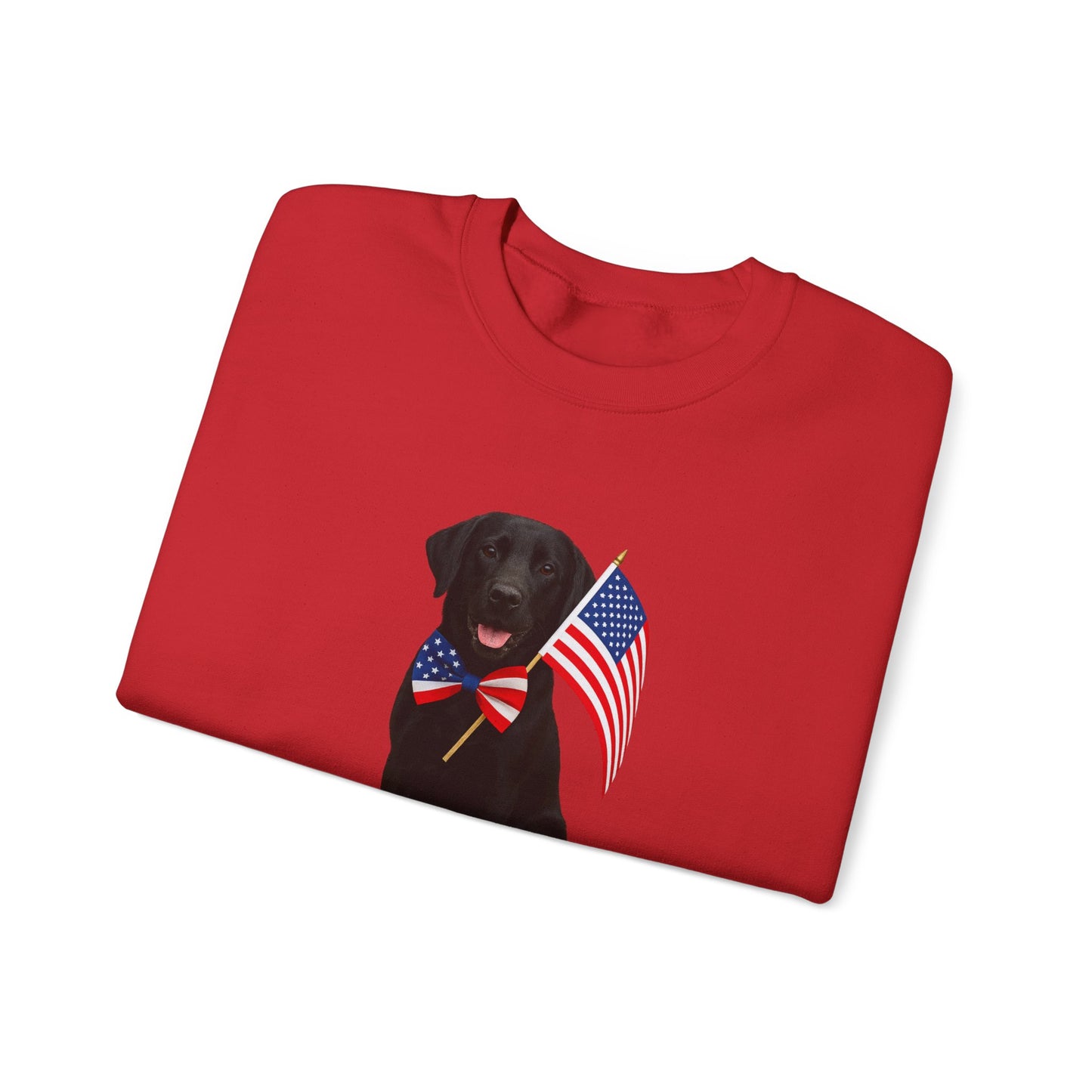 Folded red t-shirt with a black dog holding an American flag design on a white background
