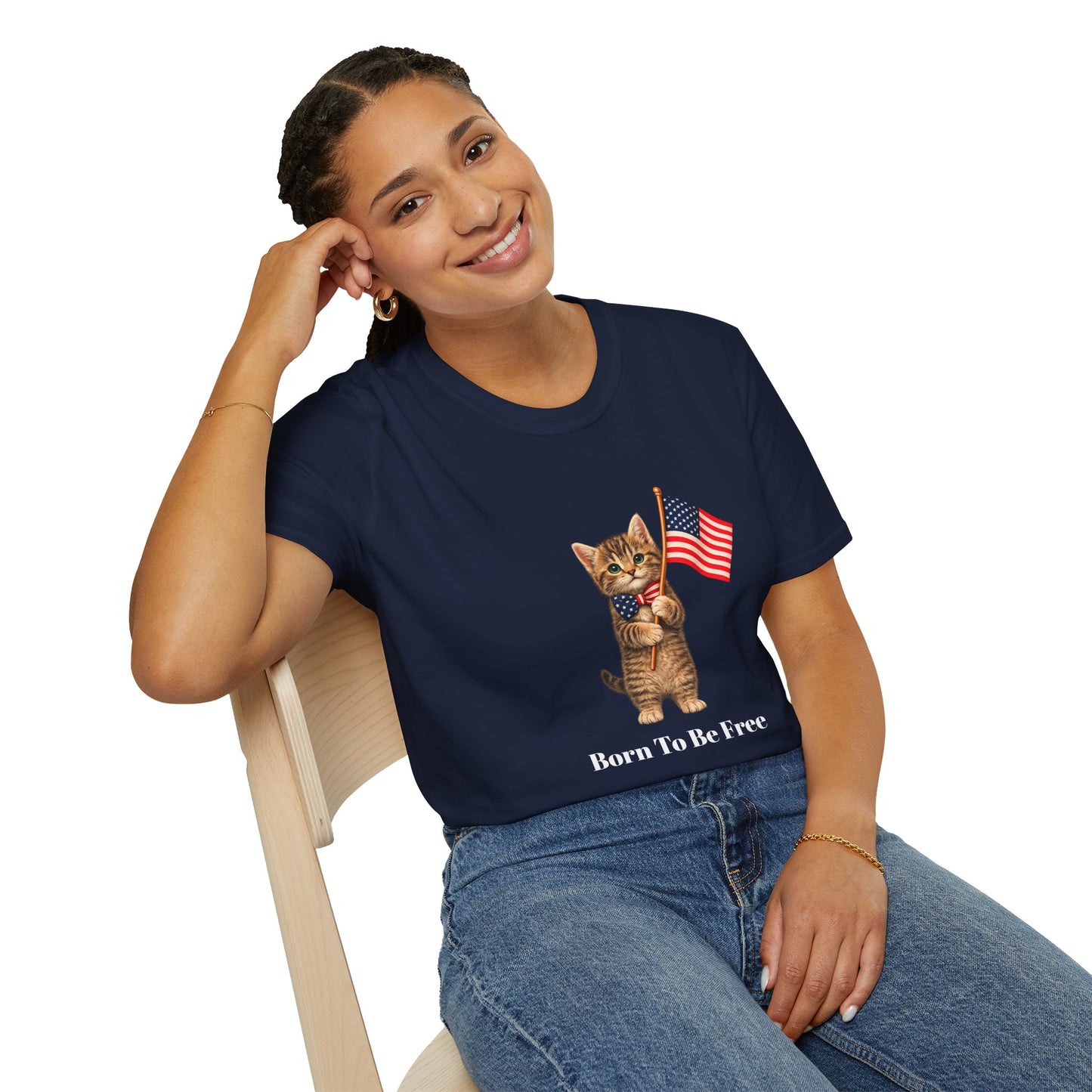Person wearing a navy blue t-shirt with 'Zen Until Proven' design, sitting on a chair.