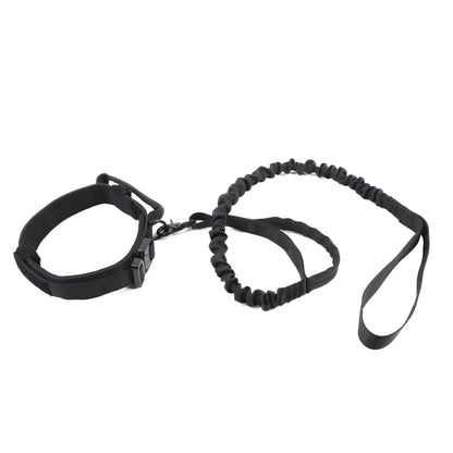 Black wrist restraint with a bungee cord on a white background