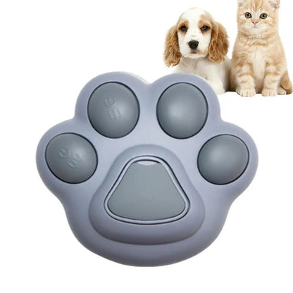 Gray paw-shaped toy with two pets in the background