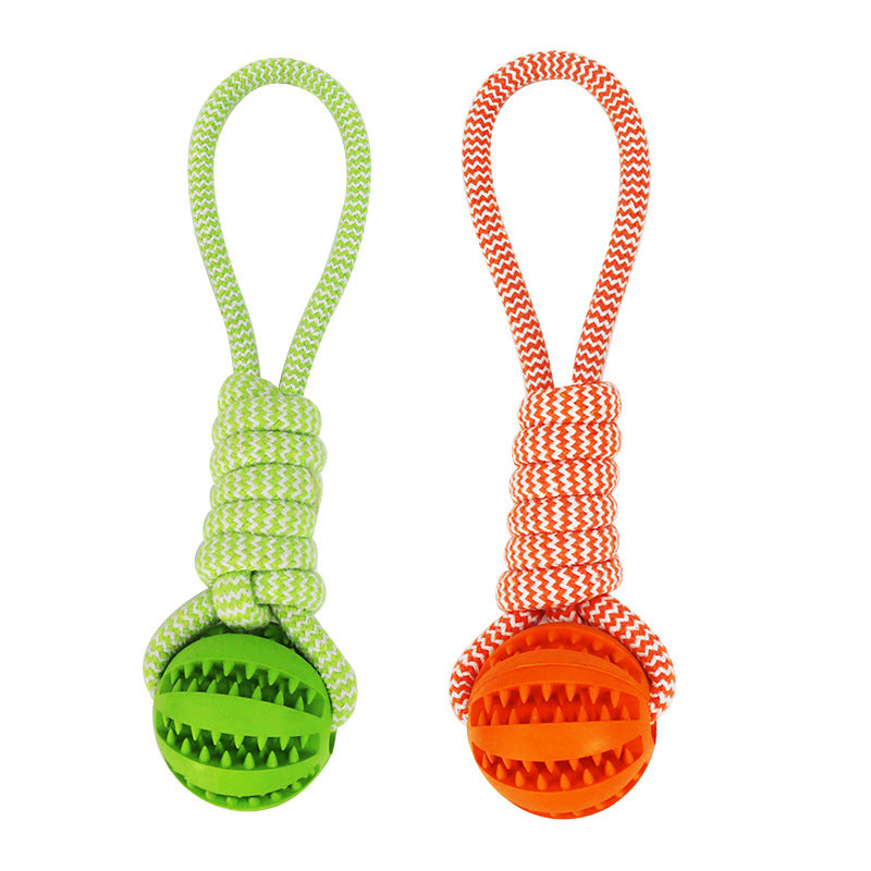 Two dog toys with green and orange balls on white background