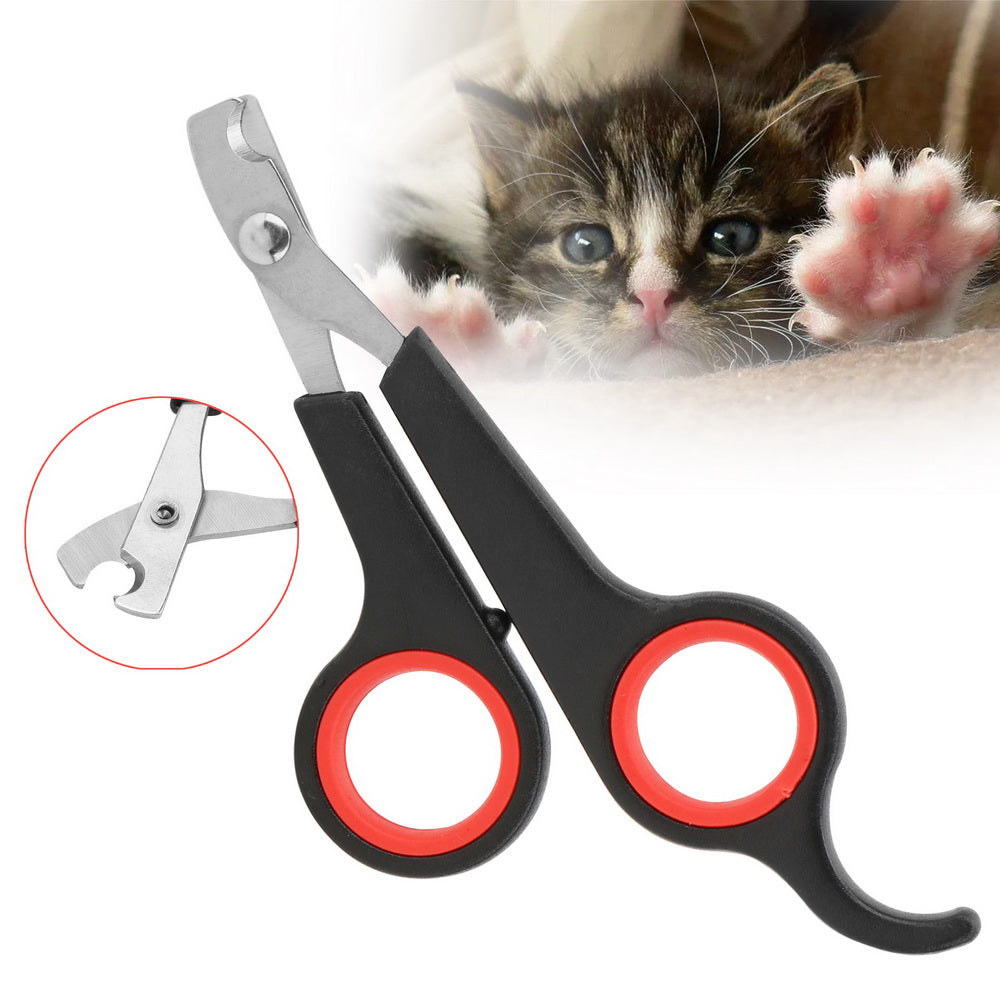 Pet nail clippers with red handles and a inset showing the tool mechanism, with a kitten in the background.