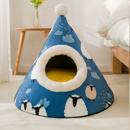 Blue pet bed with sheep pattern on a white floor
