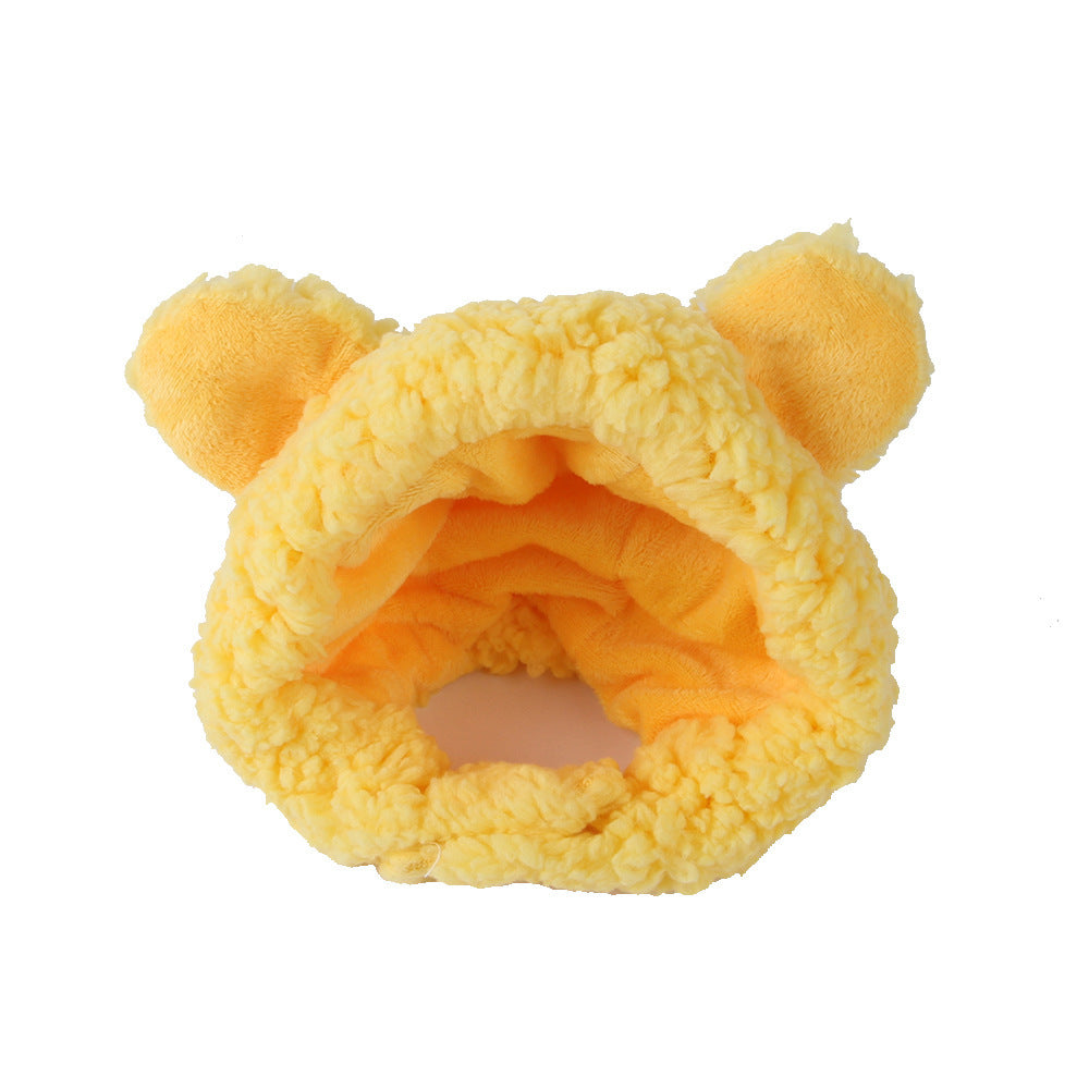 Yellow plush toy with bear ears on a white background