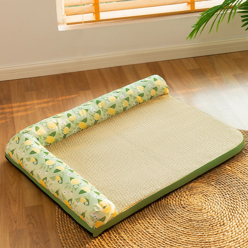 Woven mat with green floral pillow on a wooden floor