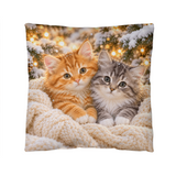 Winter kitten throw pillow featuring orange and gray kittens snuggled in a cream blanket
