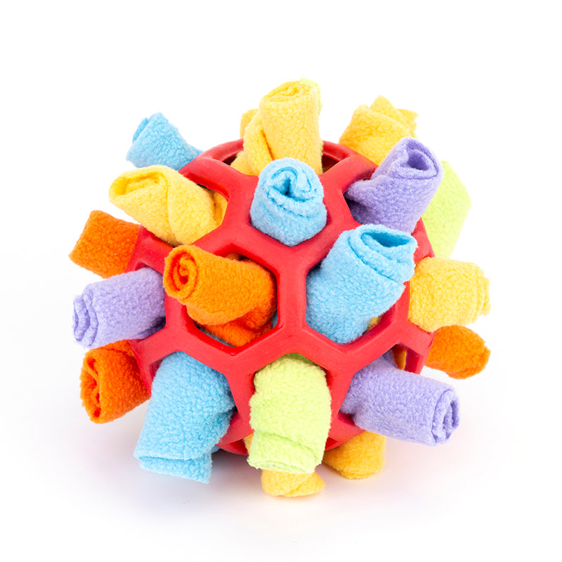 Colorful textured ball with soft cloth pieces on a white background