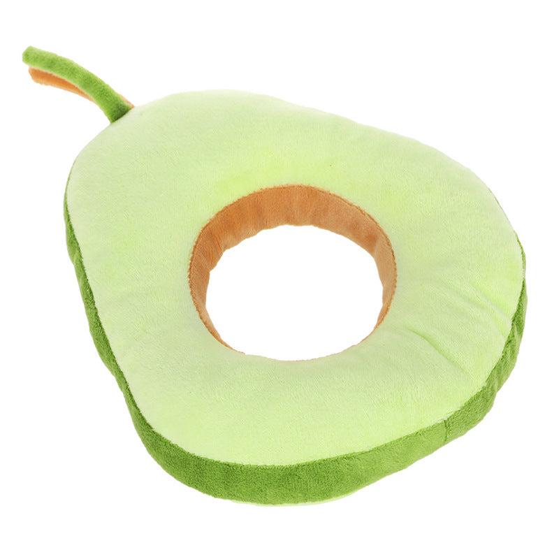 Avocado-shaped pillow on a white background