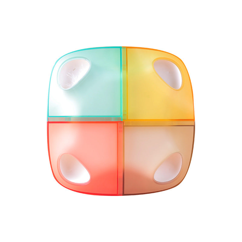 Colorful container with four compartments on a white background