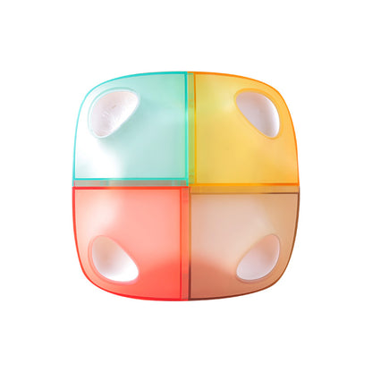 Colorful container with four compartments on a white background
