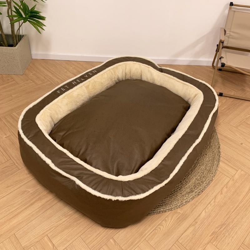 Brown pet bed with white trim on a wooden floor