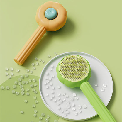 Two baby toys on a green background with small beads scattered around.