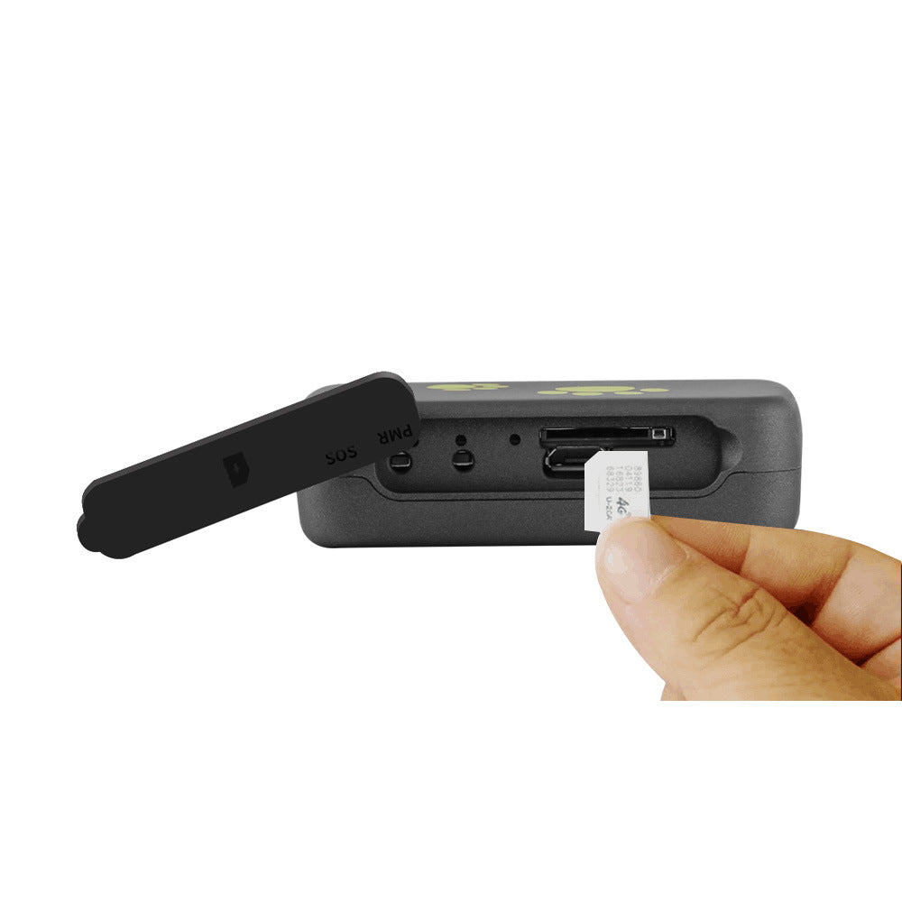 Hand holding a small electronic device with a USB stick inserted, on a white background
