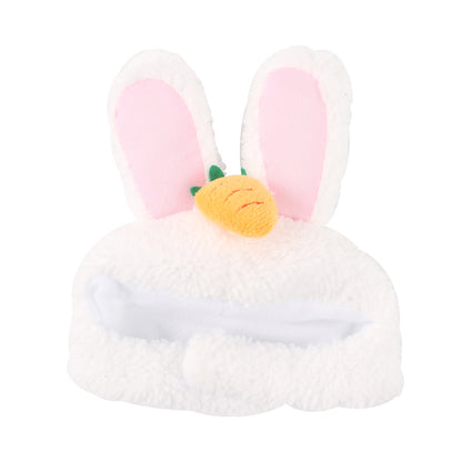 Plush toy with bunny ears and a carrot on a white background