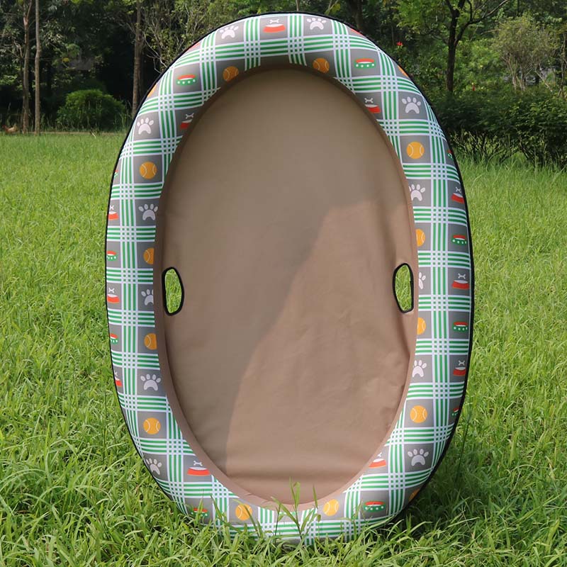 Pet bed with plaid pattern on grass