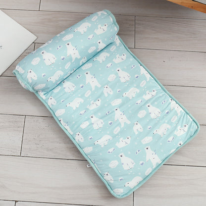 Folded blanket with polar bear pattern on a wooden floor