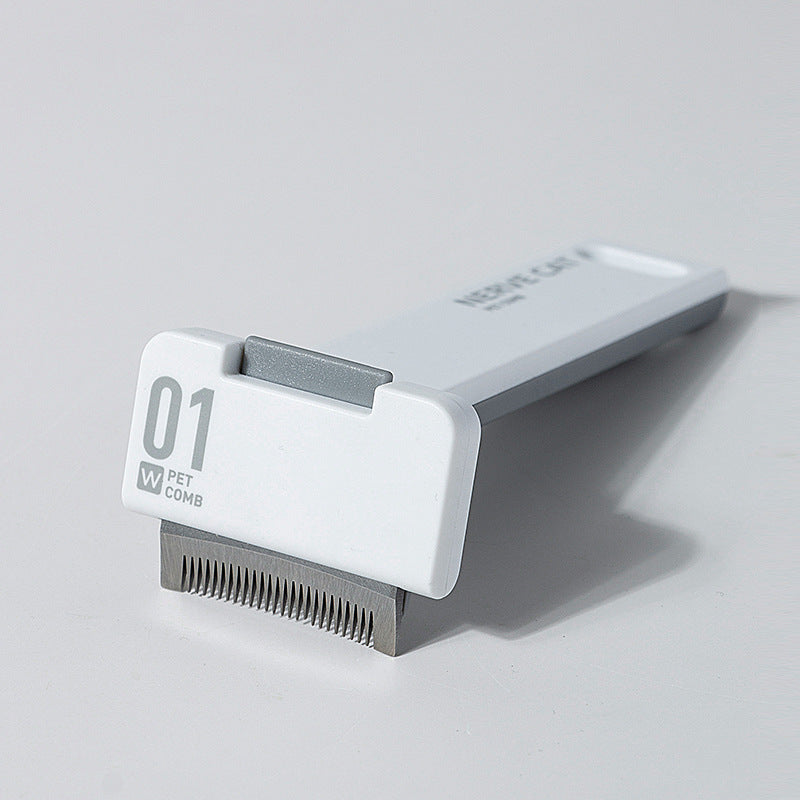 Pet grooming comb on a light gray background