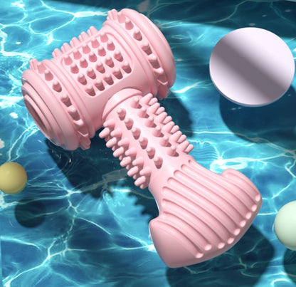 Pink textured dumbbell toy on a blue water background with floating balls.