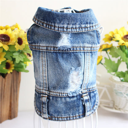 Denim dog coat on a stand with sunflowers in the background