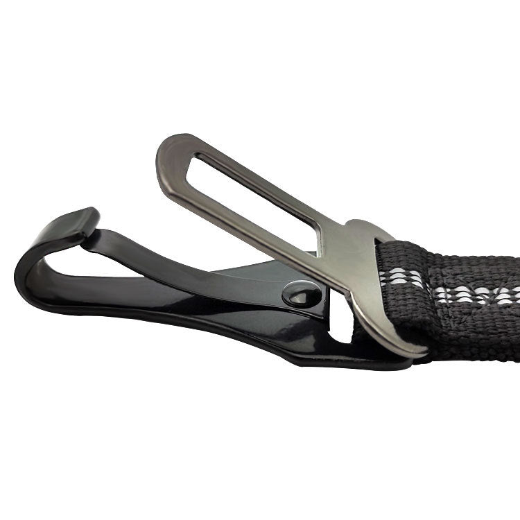 Close-up of a black strap with a metal carabiner on a white background