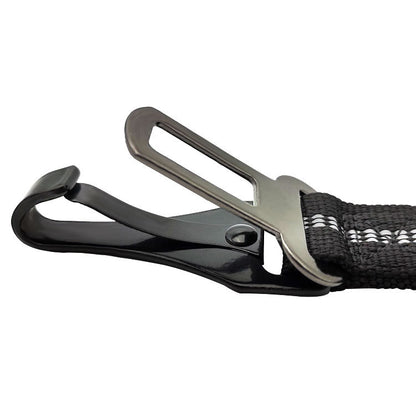 Close-up of a black strap with a metal carabiner on a white background