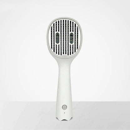 White handheld hair dryer on a light gray background