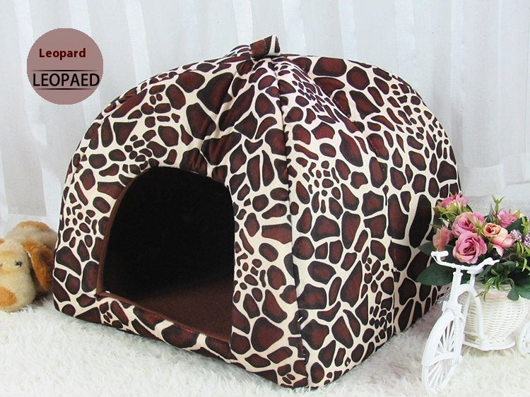 Leopard print pet bed on a white background with flowers and a teddy bear.