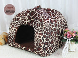 Leopard print pet bed on a white background with flowers and a teddy bear.