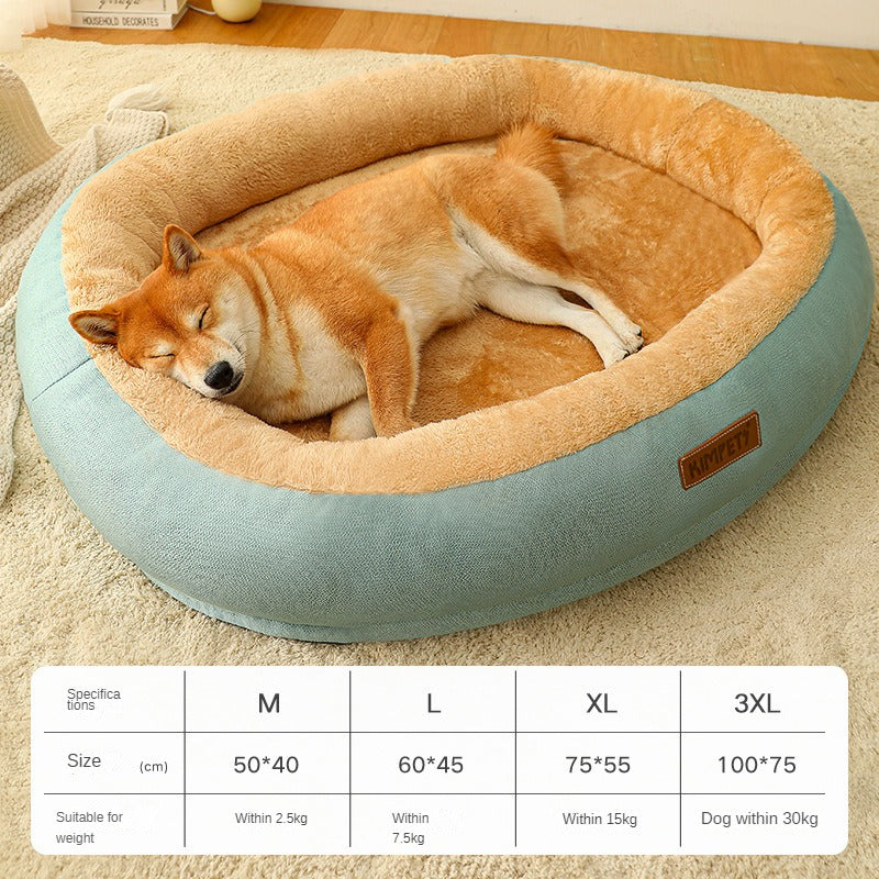 Dog sleeping in a round pet bed with size chart on a carpeted floor.