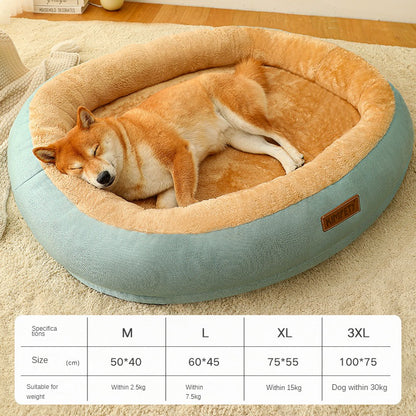 Dog sleeping in a round pet bed with size chart on a carpeted floor.