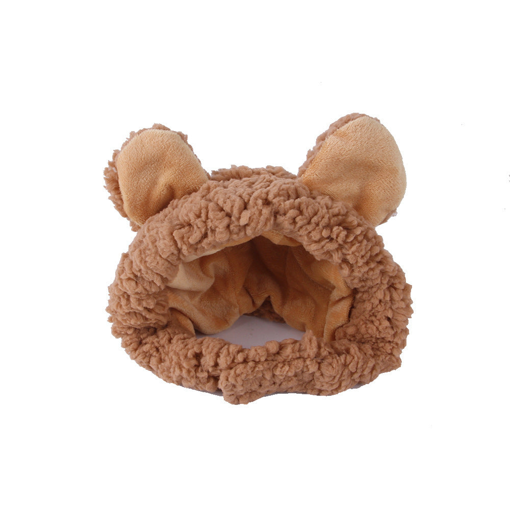 Brown fuzzy headband with bear ears on a white background