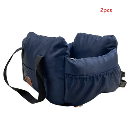 Navy blue pet carrier with straps on a white background
