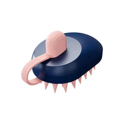 Navy blue and pink grooming tool with spiked design on a white background