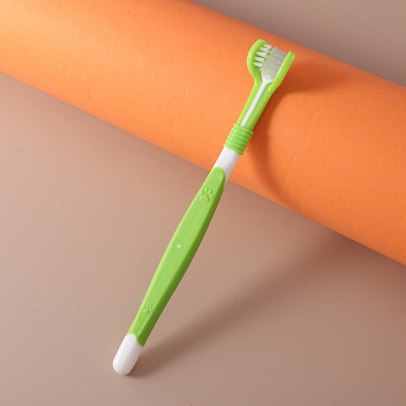 Green children's toothbrush on an orange and beige background